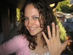 The happy fiancee with ring.